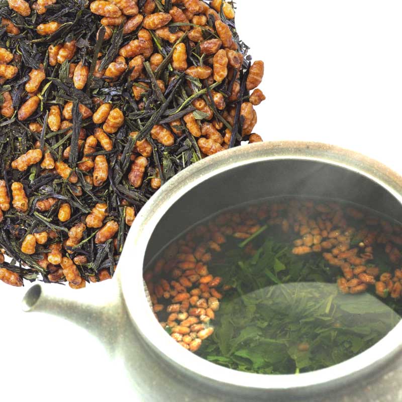 Closeup of Genmaicha Nishio in teapot showing prepared Genmaicha tea. Tasty tea with sweet aroma of roasted rice